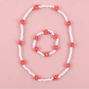 pink and white bead necklace and bracelet